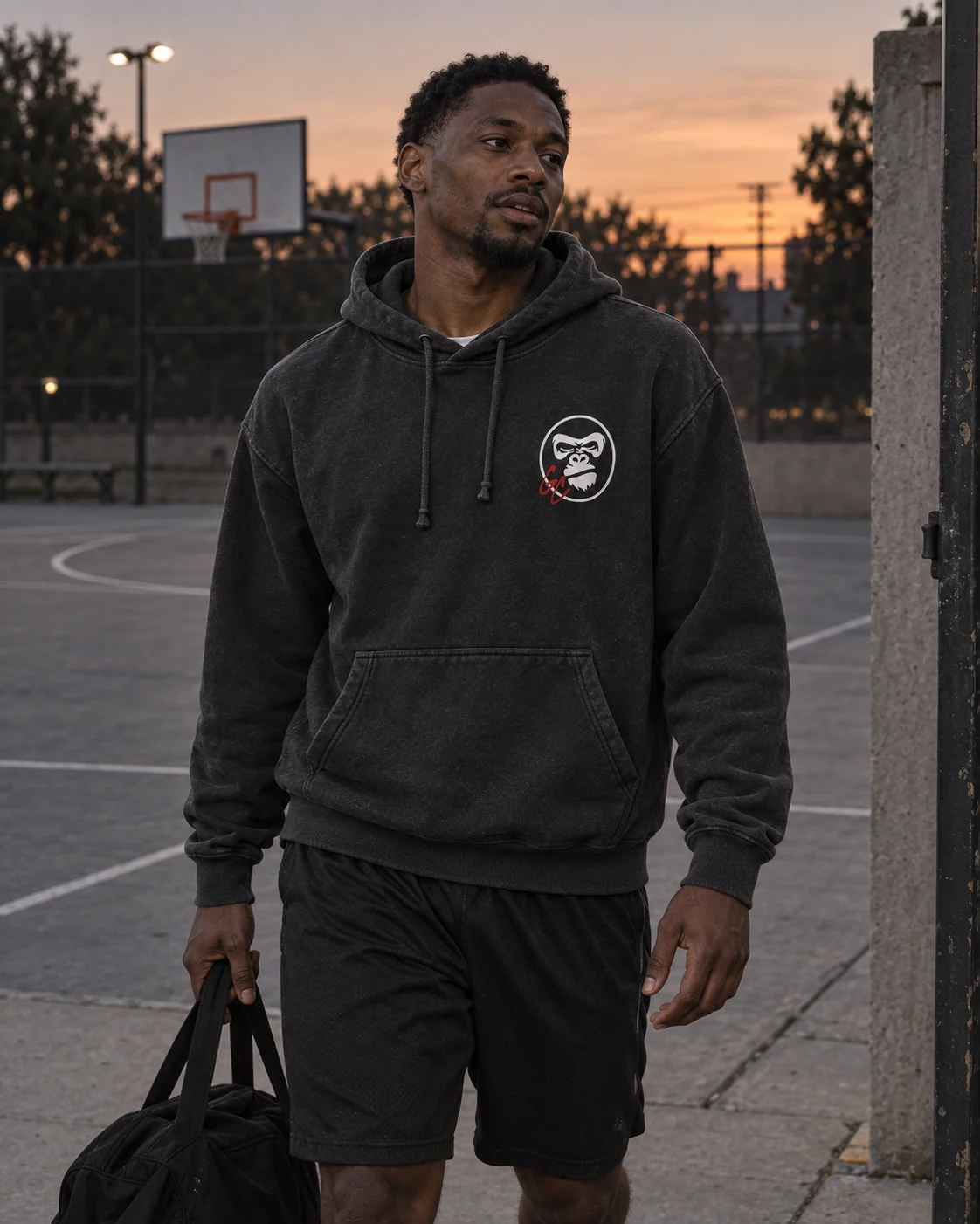 Illustrative adult athlete wearing the charcoal GC Hoodie after training