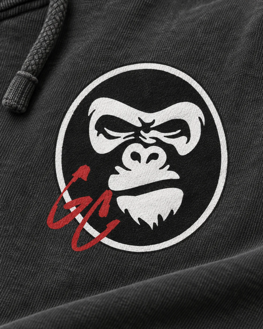 Close-up of the gorilla and red GC chest mark on the charcoal hoodie